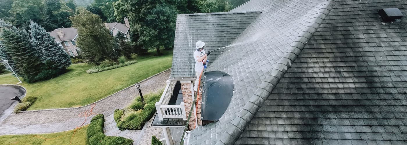 Gallo Bros soft-washing a roof in North Jersey